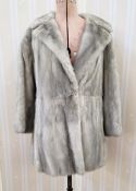 A grey mink three-quarter length coat, three-quarter length sleeves, labelled Dominion Furs, half