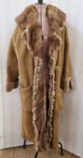 WITHDRAWN A shearling tan suede full length coat with a mink collar and trim to the front, shaved