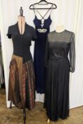 A wool and taffeta evening dress, black, the taffeta in bronze stripes, short sleeves, labelled