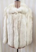 A vintage blue fox fur jacket with its original bill of sale from Furs International Bournemouth,