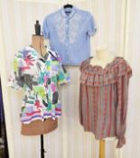 A Mary Quant cotton shirt, with bold print, a pale blue cotton blouse embroidered with white