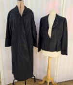 A black watered satin Edwardian evening coat, frog detail fastening to the shawl collar, deep cuffs,