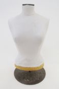 A half-size dressmaker's mannequin, labelled Vendome Faubourg St. Honore Paris Vlll, 57cm high