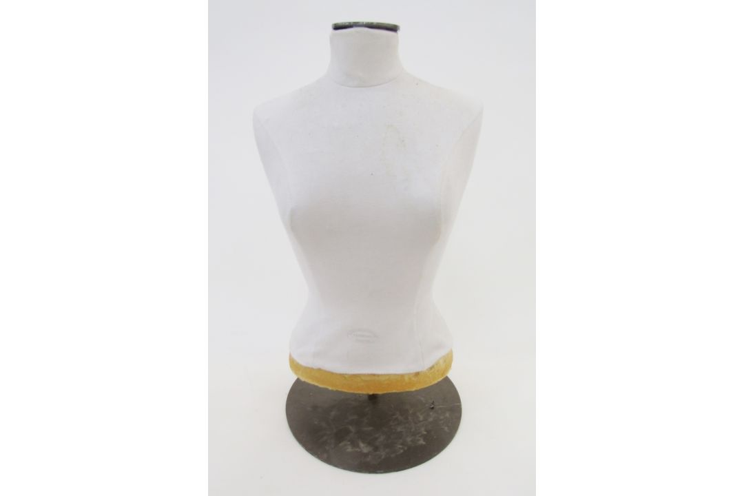 A half-size dressmaker's mannequin, labelled Vendome Faubourg St. Honore Paris Vlll, 57cm high