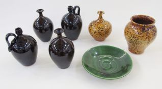 Group of British studio pottery, mostly by Russell Akerman, comprising: two earthenware bottle vases