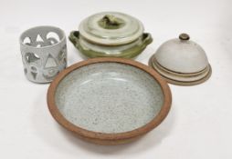 Four pieces of studio pottery to include a large dish, cheese plate and dome, a casserole and a