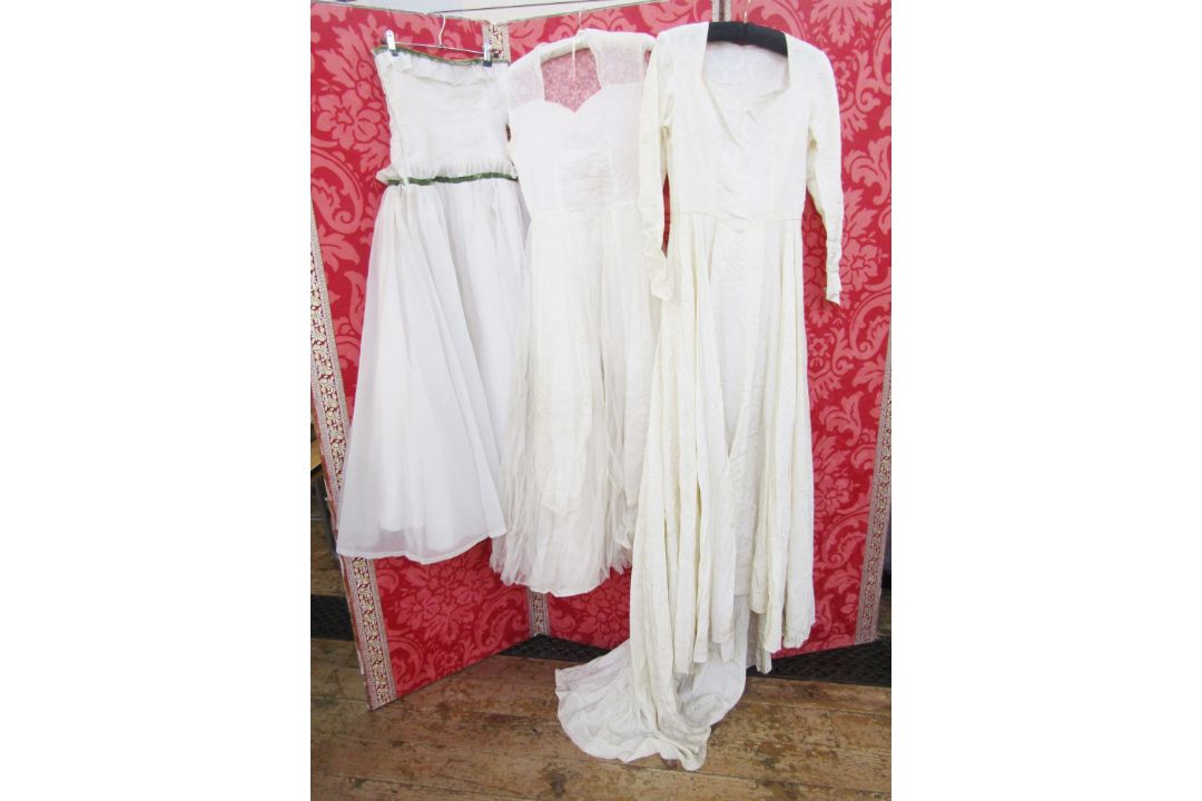 1950's wedding dress, nylon, lace, sleeveless, with a full net skirt and lace panels, a cream