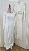 A 1930's bias cut white evening gown, the bodice embroidered with black and white thread and small