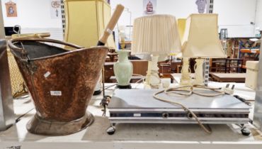 19th-century hammered copper coal scuttle with a modern coal shovel, together with a vintage