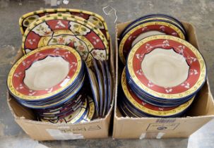 Quantity of modern tableware painted with flowers in rust, yellow and green design, comprising