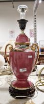 Chinese ceramic urn-shaped purple-glazed table lamp on a pierced wooden base, 41cm high