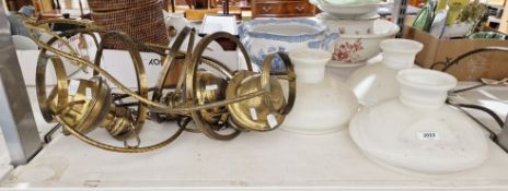 Six late 19th/early 20th century brass hanging oil lamps with six opaque brass shades