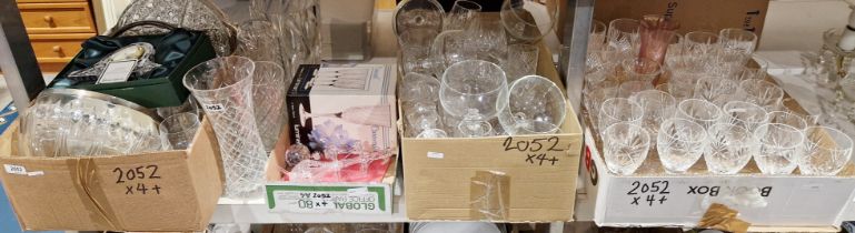 A collection of glassware, including a boxed Tyrone crystal mantel clock, cut glass wine glasses,