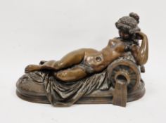 In the manner of Claude Michel Clodion, bronze model of a reclining nude woman, stamped Clodion to