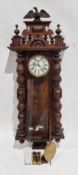 19th-century walnut-cased Vienna regulator-style wall clock, case with eagle cresting, the glazed