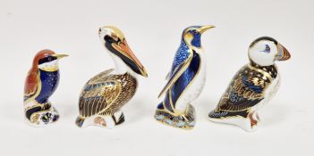 Four Royal Crown Derby bone china bird paperweights, printed red marks, comprising: a blue and