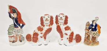 Pair of Staffordshire pottery spaniels, late 19th century, moulded no. 1 to bases, painter's