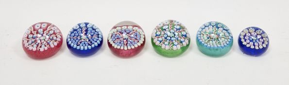Six John Deacon millefiori paperweights, some labelled, all centred with a thistle cane, flanked
