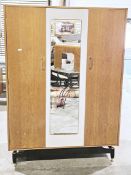 V Mid-century G-Plan Librenza range light oak wardrobe, comprising a mirrored central door and two