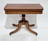 Early 19th century mahogany swivel top card table, rectangular with curved corners, on ring turned