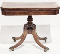 Early 19th-century rosewood fold-over card table, the hinged satinwood line inlaid top with canted