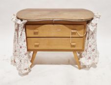 Mid-century dressing chest, the top of kidney form over two long drawers with moulded handles, on