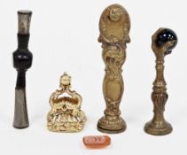 Four 19th-century seals, including a yellow metal and intaglio-carved carnelian seal fob pendant,