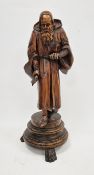 19th-century European carved wooden sculpture of a bearded monk or elderly man, dressed in a