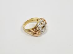 Yellow metal and diamond five-row bombe ring, the five split row grain set white metal and raised