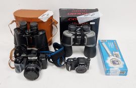 Minolta DYNAX 5000i camera with Sigma 1:3.5-4.5 f=35-70mm lens, together with Canon powershot