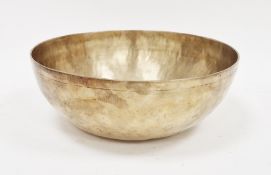 Tibetan hammered bronze singing bowl with engraved double-concentric lines to the well, 28.5cm