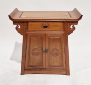 Chinese hardwood altar cabinet, the over-hanging scroll edge top over a frieze drawer over two
