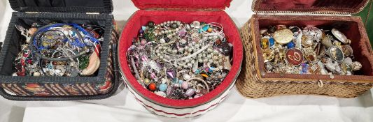 Three vintage sewing baskets filled with costume jewellery, including pendants, necklaces, beads,