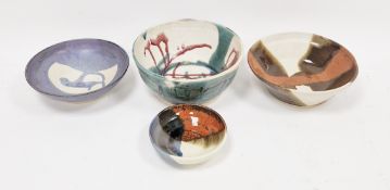 Four Contemporary Japanese studio pottery bowls, incised characters aand numerals, in sizes,