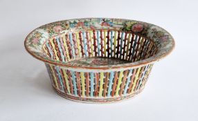 A Chinese Export Canton famille rose pierced oval basket, 19th century, painted with figures in