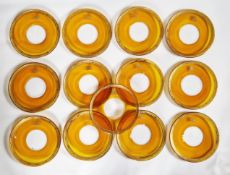 Set of thirteen amber glass and gilt decorated plates, monogrammed to rims, diameter 21cm (13)