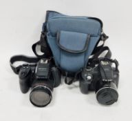 Canon Powershot SX50 HS digital camera, together with Fuji Finepix HS 20 EXR digital camera and a
