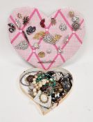 Approximately twenty-two costume jewellery brooches, including an agate set Scottish dirk brooch,