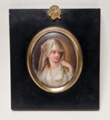 Continental porcelain framed oval portrait plaque, late 19th century, painted with a bust-length