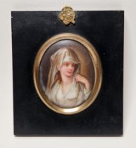 Continental porcelain framed oval portrait plaque, late 19th century, painted with a bust-length