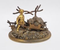 19th-century gilt bronze novelty inkwell, in the form of a child pushing a wheelbarrow of