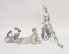 Lladro porclain figure of the sad harlequin, modelled seated on rockwork with a mandolin, 35.5cm