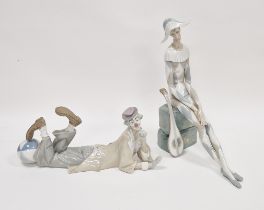 Lladro porclain figure of the sad harlequin, modelled seated on rockwork with a mandolin, 35.5cm
