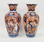 Pair of Japanese imari fluted oviform vases, Meiji period, painted with birds perched amongst