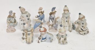 Collection of Lladro figures, including: several figures of clowns and children dressed as clowns,