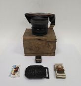 World War II box respirator gas mask marked D.R.CO.M2 1939, together with a quantity of cigarette