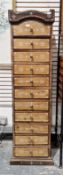 V Indian hardwood tall chest comprising eleven short drawers, having a shaped top, mother of pearl