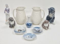 Royal Copenhagen model of a grey cat seated, two others by Bing und Grondahl, smaller, all with