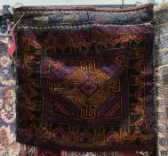 Baluchi red ground camel bag with central geometric medallion and geometric borders, 64cm x 66cm