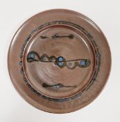 Ray Finch (1914-2012) for Winchcombe Pottery; a stoneware charger covered in iron rich glaze with